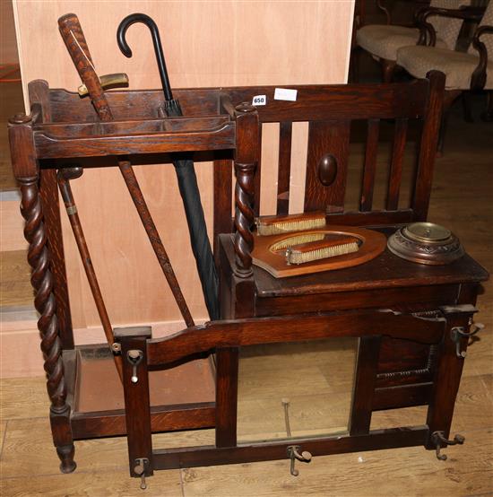An oak hall stand, 3 walking sticks, a mirror & barometer, W.97cm